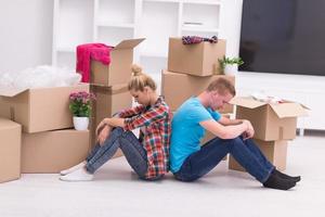 young couple moving  in new house photo