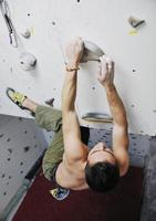 Man rock climbing photo