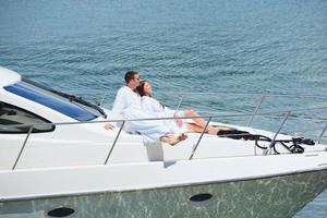 young couple on yacht photo