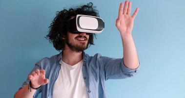 man using VR headset glasses of virtual reality photo