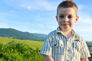 Boy enjoying outdoors photo