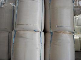 Chemical fertilizer The product stock is packed in sacks, stacked in the warehouse, waiting for delivery. photo