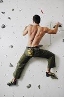 Man rock climbing photo