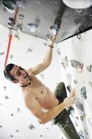 Man rock climbing photo