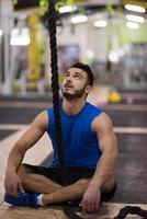 man relaxing before rope climbing photo