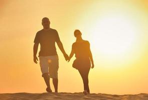 couple enjoying the sunset photo