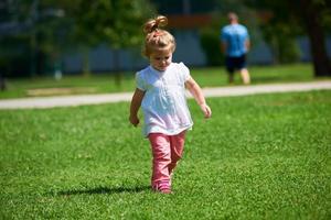 little girl have fun in park photo