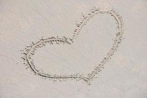 happy couple have fun on the beach photo