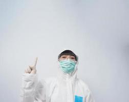 Doctor in PPE suit gesture make hand sign. Represent victory win over virus.