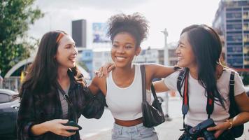 A group of multi-ethnic female friends enjoying the city tour. photo