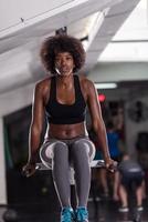 black woman doing parallel bars Exercise photo