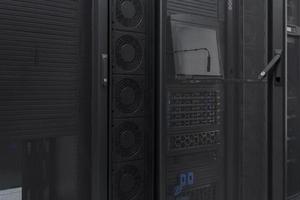 Data Center With Multiple Rows of Fully Operational Server Racks. Modern Telecommunications, Cloud Computing, Artificial Intelligence, Database, Supercomputer Technology Concept. photo