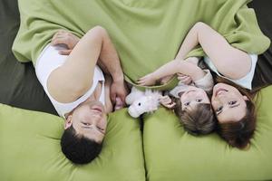 happy family relaxing in bed photo