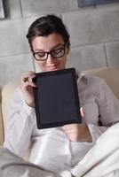 woman using tablet pc at home photo