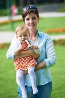 mother and baby in park photo