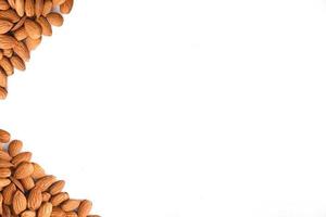 Top view of framed pile of almonds on white background. For variants. photo