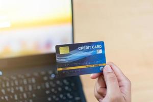 Online payment using credit card. Input card number for online money transaction. photo