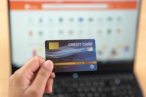 Online payment using credit card. Input card number for online money transaction. photo