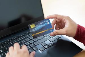 Online payment using credit card. Input card number for online money transaction. photo