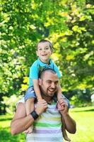 happy father and son have fun at park photo