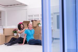 young  gay couple moving  in new house photo