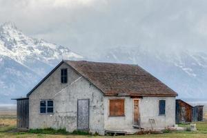 Wyoming, USA, 2014. View of a derelict house at Mormon Row near Jackson Wyoming photo