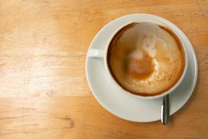 Top view of coffee cup that empty after finished drinking. photo