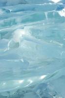 Background image of transparency blue ice pan in stacked layer. photo