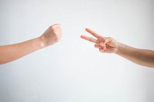 Hammer symbol and scissors symbol in playing rock paper scissors game on white background. photo