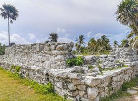 Ancient Tulum ruins Mayan site temple pyramids artifacts seascape Mexico. photo