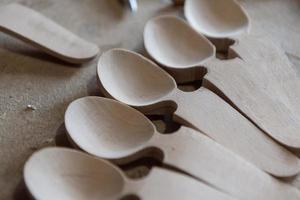 Handmade Wooden Spoons for hiking and outdoor activities. Craftsmanship and artisan concept photo