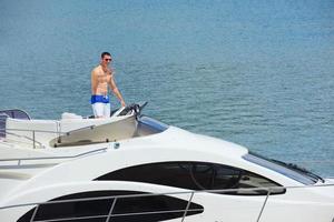 young couple on yacht photo