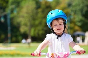 little girl with bicycle photo