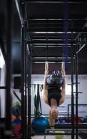 woman working out on gymnastic rings photo