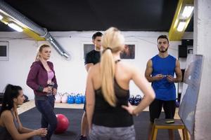 athletes getting instructions from trainer photo