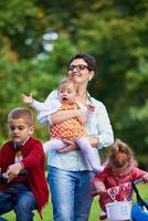 modern mother portrait  with kids in park photo