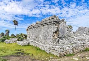 Ancient Tulum ruins Mayan site temple pyramids artifacts seascape Mexico. photo