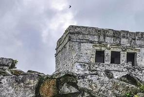 Ancient Tulum ruins Mayan site temple pyramids artifacts seascape Mexico. photo