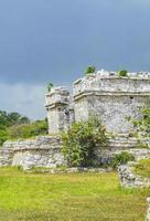 Ancient Tulum ruins Mayan site temple pyramids artifacts seascape Mexico. photo