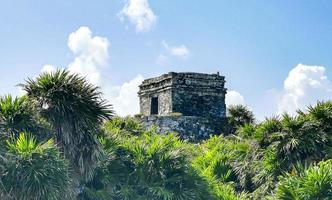 Ancient Tulum ruins Mayan site temple pyramids artifacts seascape Mexico. photo