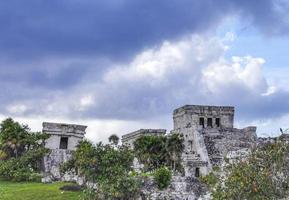 Ancient Tulum ruins Mayan site temple pyramids artifacts seascape Mexico. photo