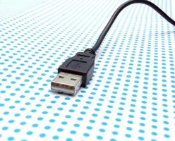 USB cable on dotted background photo
