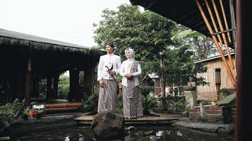 young indonesian moeslim couple with wedding dress photo