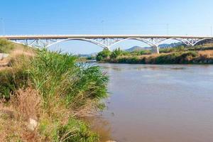 Llobregat River and the bridge that crosses the river at Sant Feliu de Llobregat photo