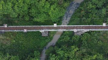 Top view aerial of railways bridge crossing a river photo