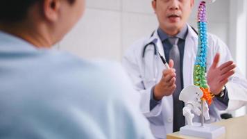 A male doctor is explaining to the patient the cause of the patient's condition. photo