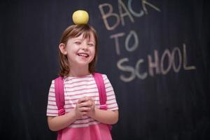 child holding apple on head photo