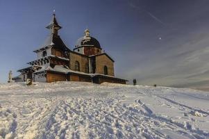 Wooden church in winter photo