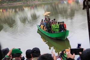Dieng, Indonesia - August 1, 2015. Dieng Culture Festival, Tourists follow the dreadlocks procession during the Dieng Culture Festival event at Dieng, Banjarnegara district, Central Java photo