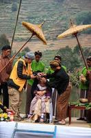 Dieng, Indonesia - August 1, 2015. Dieng Culture Festival, Tourists follow the dreadlocks procession during the Dieng Culture Festival event at Dieng, Banjarnegara district, Central Java photo